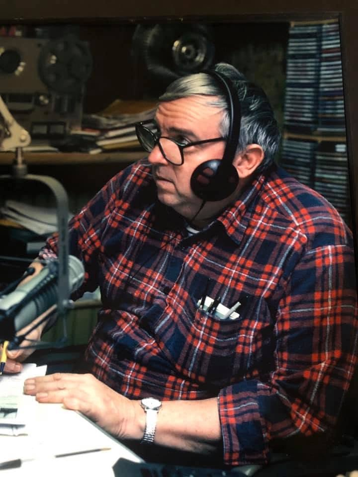 Wayne Price at the radio studio microphone